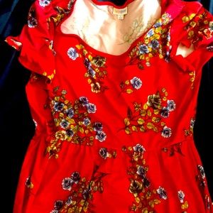 Stretchy red dress with slit sleeves.